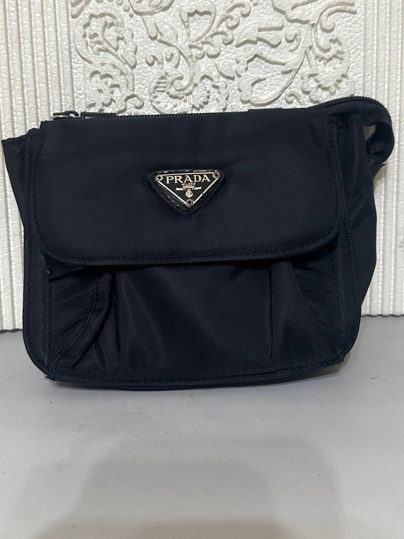 Prada Nylon Belt Bag (Category: Luxury Bags & Wallets) located in Manila. Submitted by shopaholic_gurl (Listing ID 1266779369, Image 1). Description: Excellent condition Black nylon material No internal tags No belt included 2 compartment 15x12cm No flaws Sold as is.