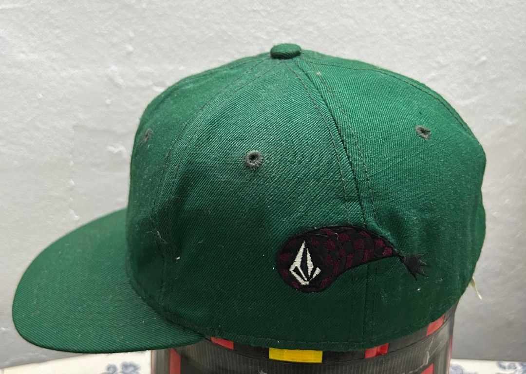 Volcom cap (Category: Cap & Hats) located in Klang. Submitted by bundleiz (Listing ID 1375793723, Image 1). Description: -Volcom cap -Full cap -Size 7½ -Nice green -Condition 9/10 ( Used item) -Price can nego -Postage add on RM10/DFOD.