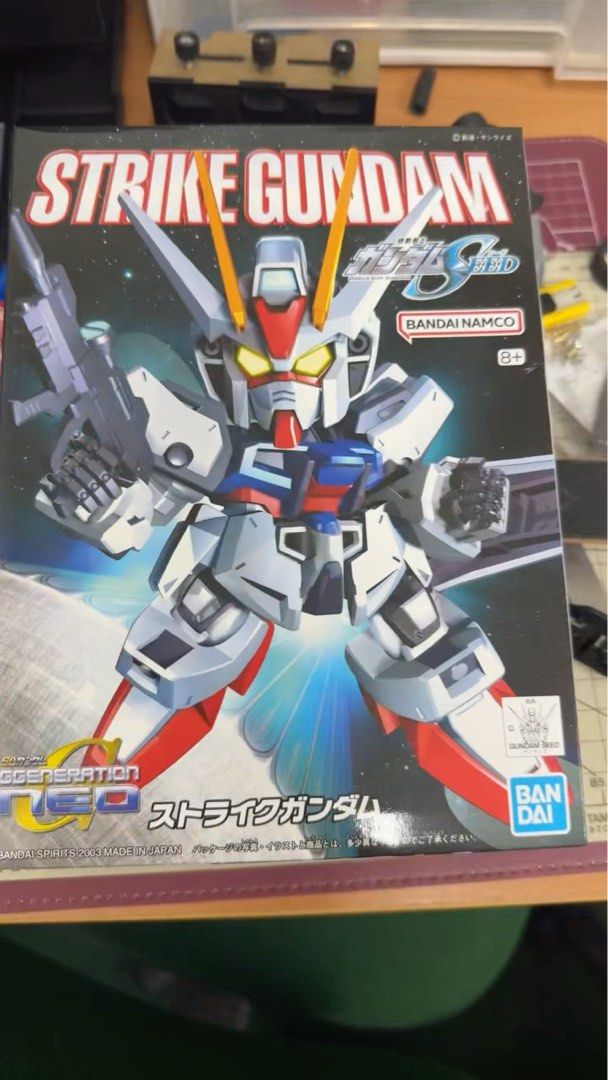 Bandai SD G Generation Neo Strike Gundam Model Kit (Category: Gundam Model Kits) located in Singapore. Submitted by atz_sg (Listing ID 1372605747, Image 1). Description: Check out this brand new Strike Gundam model kit! It's still in its original box and made in Japan. This model is part of the SD G Generation Neo series. It's a great addition to any Gundam collection. The box art is really cool, and it's sure to be a fun build. Get yours today!.