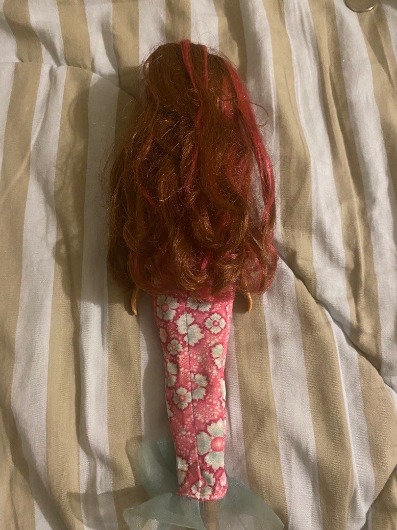 Barbie Dolphin Magic Doll (Category: Kids Toys) located in Quezon City. Submitted by elisabelle21 (Listing ID 1372622395, Image 3). Description: Doll is in very played with condition, arms are loose. WYSIWYG .