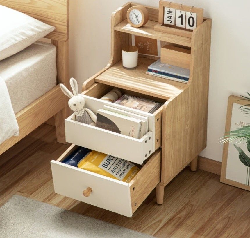 Bedside Table (Category: Shelves, Cabinets & Racks) located in Singapore. Submitted by treasured_gems (Listing ID 1372489046, Image 1). Description: Like new side table book shelf in perfect condition. Many useful drawers and practical. Nice natural beige and white colour. Seee images for size. Retails over $130 brand new, priced to sell. Only 1 available. Pick up Newton PM.