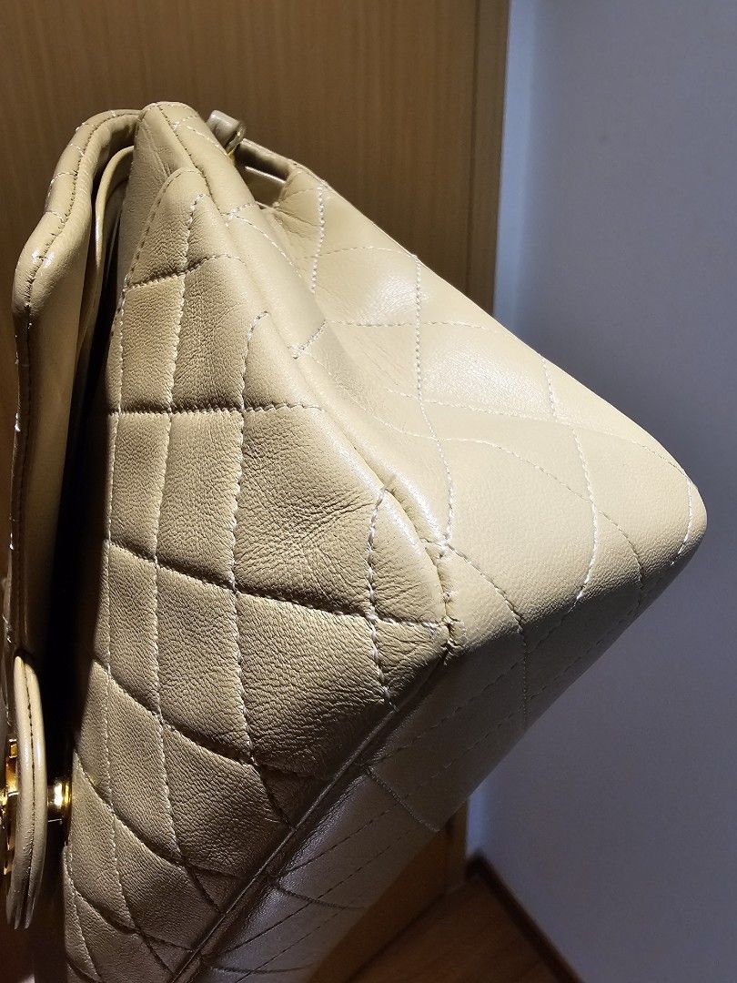 Chanel medium classic in beige/tea vintage in lambskin and gold hardware (Category: Bags & Wallets) located in Singapore. Submitted by ifiwasntabanker (Listing ID 1372629674, Image 2). Description: Beautiful lambskin vintage. It has the flat squares. Solid gold hardware. Just a beautiful overall. Comes with authenticity card and serial in bag..