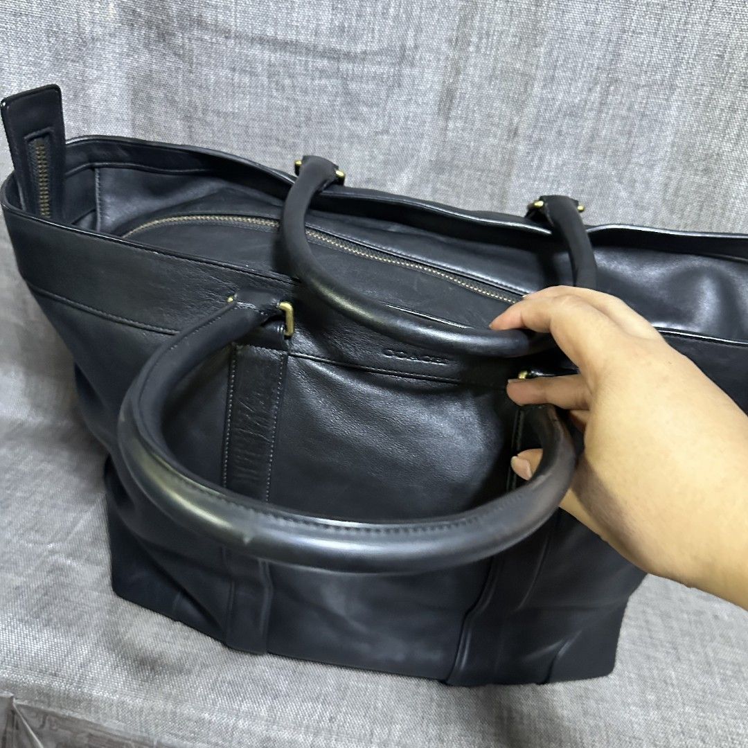 Coach travel bag (Category: Luxury Bags & Wallets) located in Manila. Submitted by greyinfash06839 (Listing ID 1372623149, Image 3). Description: 🤍Item: Coach travel bag 🤍Brand: Coach 🤍Matirial: Leather 🤍Quality: Original 🤍color: Black 🤍Size: XL 🤍Dimension. H: 14 L: 16 W: 8 🤍Sex: Unisex 🤍Issue: Minimal sign of use 🤍Condition Rate: 9/10 🤍Other info:.