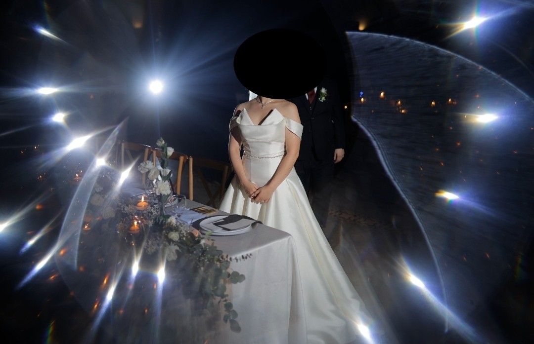 Ivory & White Wedding Gown (Daphne) (Category: Evening dresses & gowns) located in Makati City. Submitted by ClothesAndStuff (Listing ID 1372607365, Image 1). Description: Customized Daphne Bridal Gown Original Value: PHP 53,000 Description: This timeless and elegant ivory bridal gown, crafted from premium Duchess Satin, exudes sophistication and grace. This minimalist design is elevated by a stunning silver glass crystal belt and a full-covered 