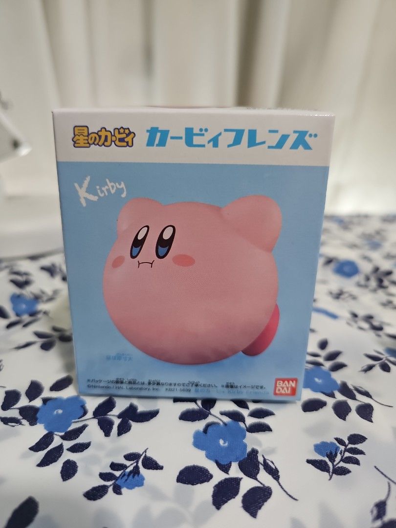 Kirby Friends Figure Blind Box from Bandai (New) (Category: Designer & Blind Box Toys) located in Singapore. Submitted by cutemah (Listing ID 1372579846, Image 1). Description: The item in the image is a Kirby Friends Figure Blind Box from Bandai. Each box contains one of eight possible soft vinyl figures of Kirby in different poses, including a rare rainbow-colored version. These figures are about 6 cm tall and are meant to be collected and trad