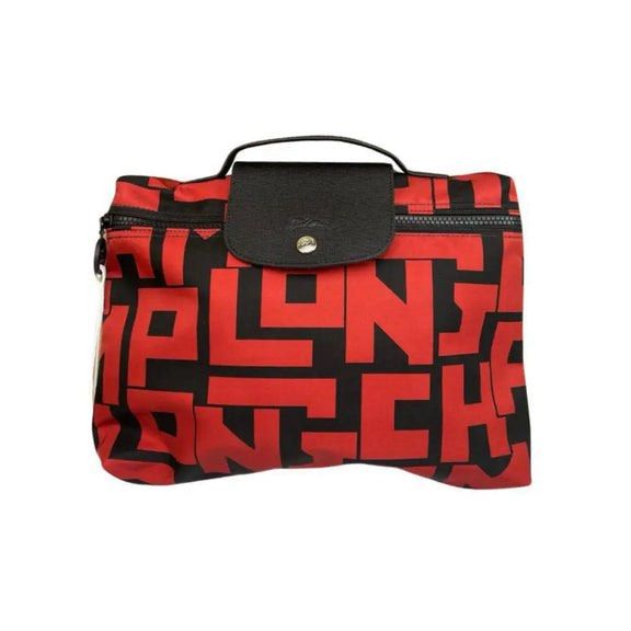 Longchamp Le Pliage red document bag (Category: Luxury Bags & Wallets) located in Quezon City. Submitted by lilynlace.thecoll (Listing ID 1361347889, Image 1). Description: Bought in Paris! With its compact design, it offers both style and functionality. The iconic black and red design adds a touch of sophistication while the top handle allows for easy carrying. Its material is ofPolyamide canvas with inside coating Metallic Hardware : Silver col
