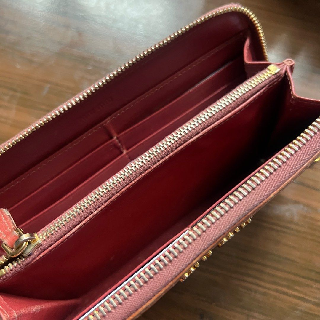 Miu Miu Leather Wallet (Category: Luxury Bags & Wallets) located in Binan City. Submitted by wordlywardrobe (Listing ID 1372530511, Image 2). Description: Original Miu Miu bought from Japan. Inside is still in great condition, some flaws outside hence the price. A cute salmon pink brown color with crocodile / alligator patent leather accent. Super cool find! .