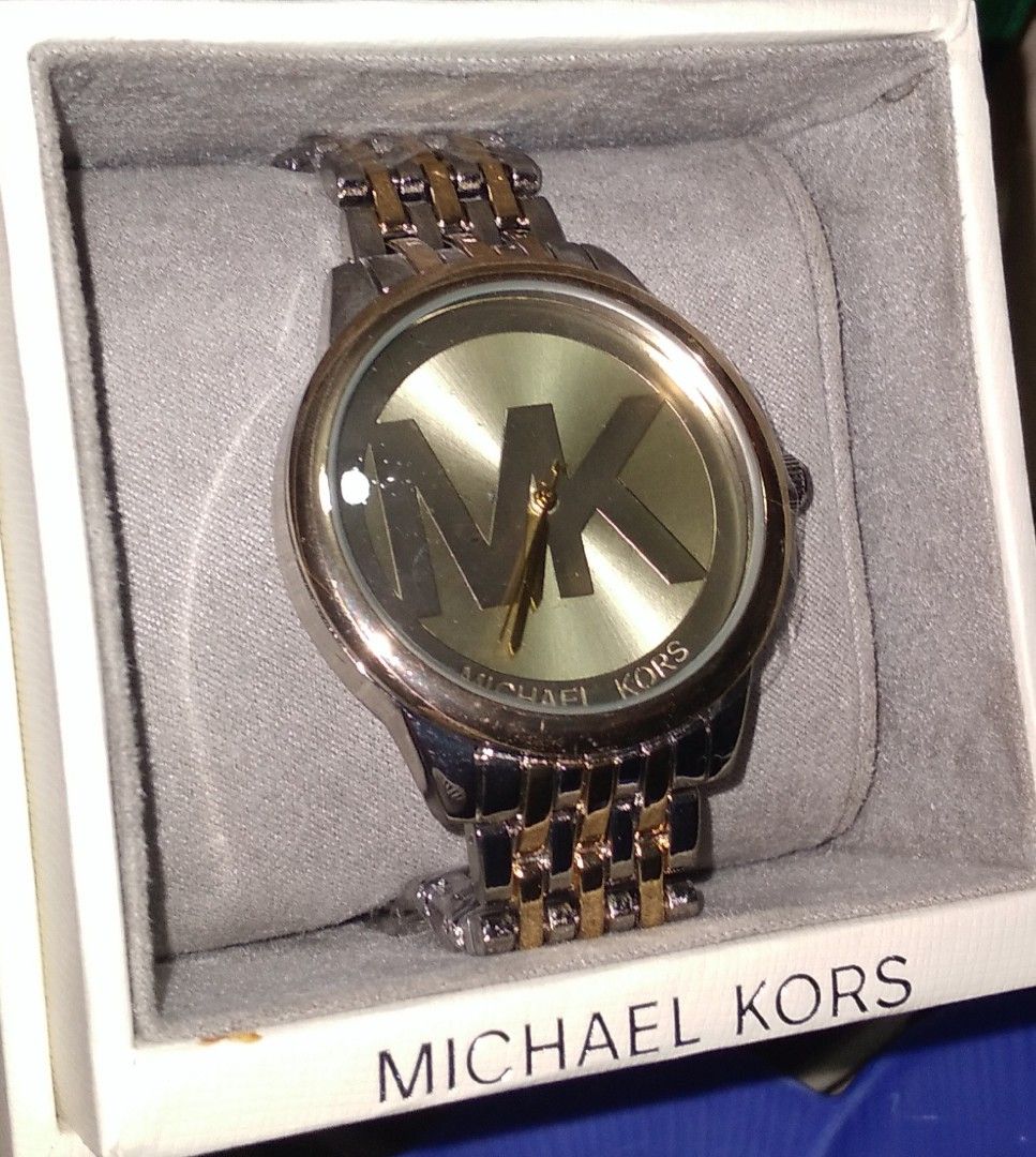 MK men's watch (Category: Men's Watches) located in Rodriguez. Submitted by maycol (Listing ID 1372590632, Image 1). Description: two toned wrist watch with box and bag.