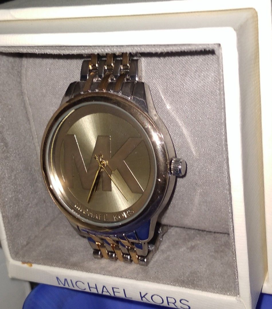 MK men's watch (Category: Men's Watches) located in Rodriguez. Submitted by maycol (Listing ID 1372590632, Image 2). Description: two toned wrist watch with box and bag.