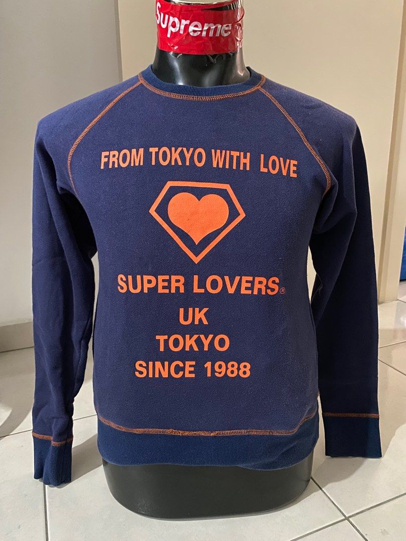 Superlovers Pullover (Category: Coats, Jackets and Outerwear) located in Kuala Lumpur. Submitted by sedehalim (Listing ID 1372551745, Image 1). Description: Super Lovers “From Tokyo With Love” Pullover – Blue (P16.5, L22.5) • Pit to Pit (P): 16.5 inches • Length (L): 22.5 inches • Material: Soft and lightweight cotton blend • Design: Pullover style with ribbed sleeves and hem A standout piece perfect for fans of vintage Harajuku fashion, punk sty