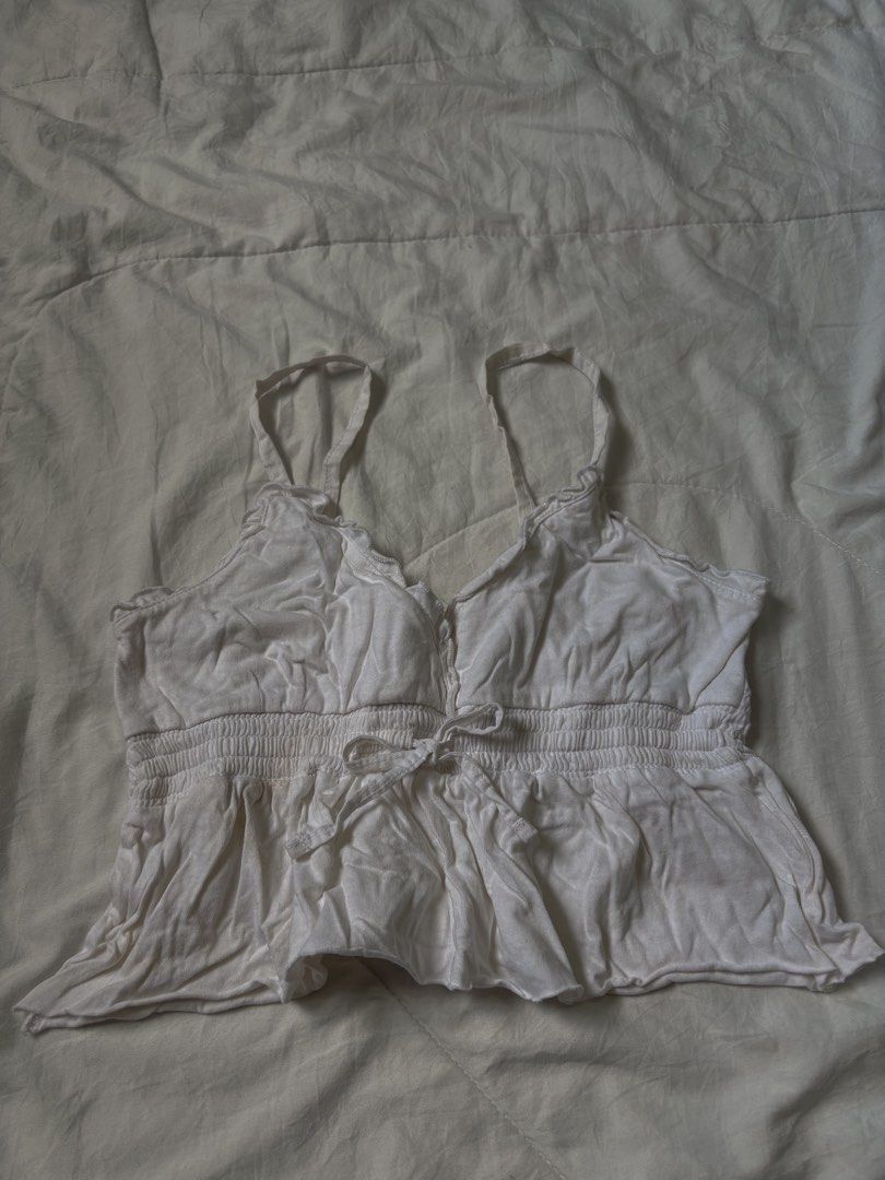 white cotton peplum top (Category: Sleeveless) located in San Antonio. Submitted by lostnfoundph (Listing ID 1372501304, Image 2). Description: with signs of usage fits xs-s.