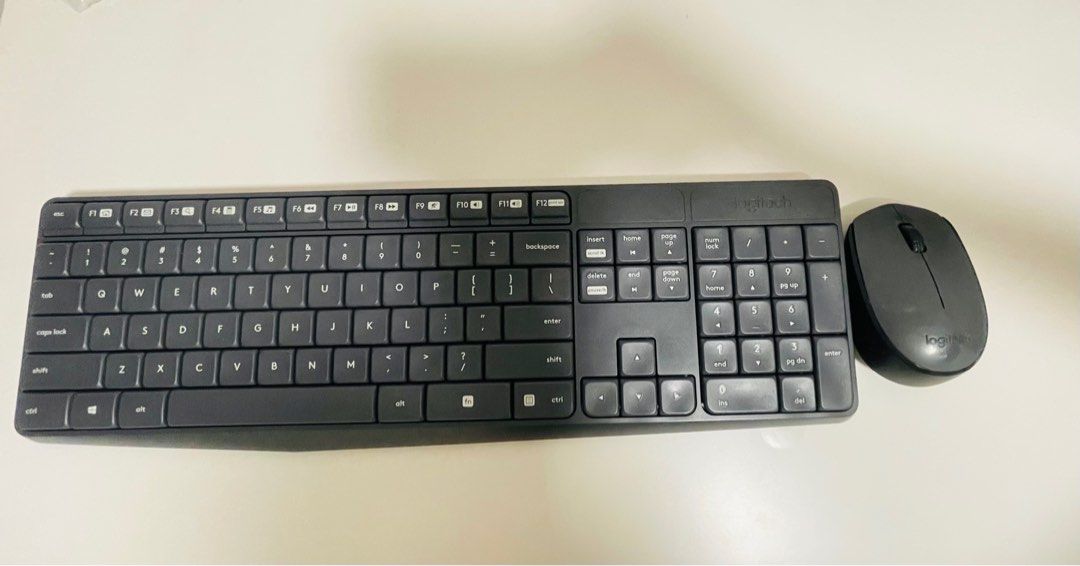 Wireless keyboard and mouse set (Category: Computer Keyboard) located in Singapore. Submitted by misssotongnegotiable (Listing ID 1372586136, Image 1). Description: M170 and K235.