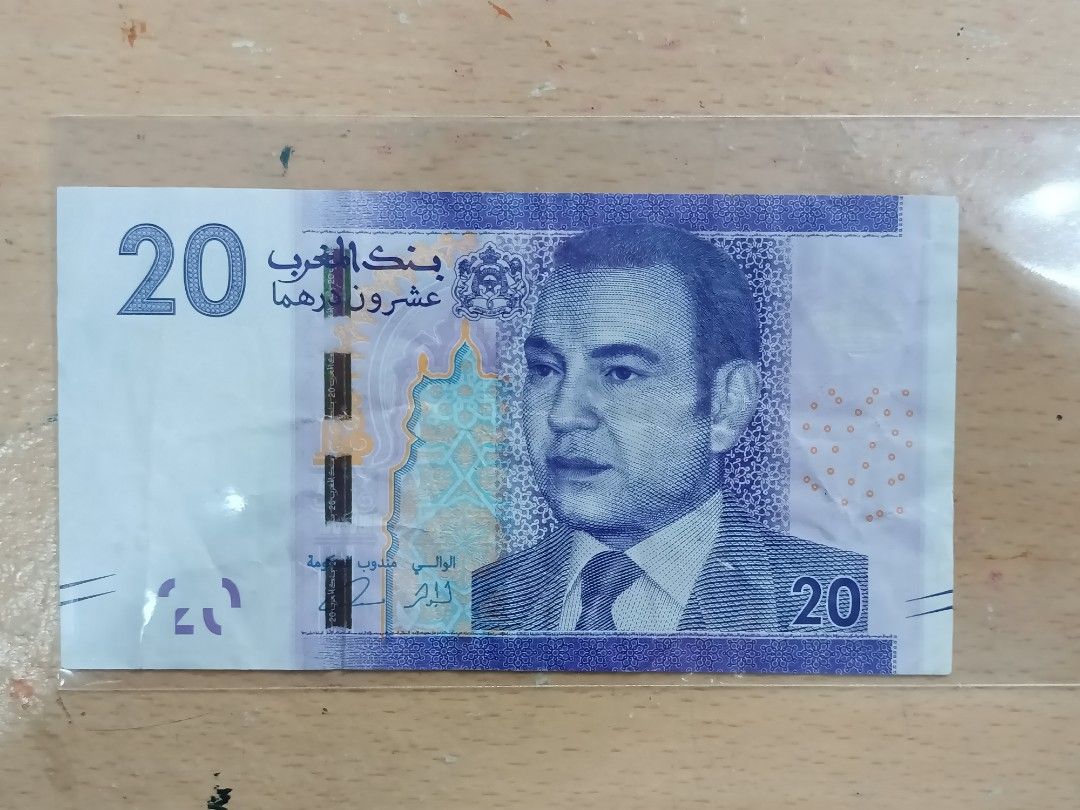 20 Morocaan Dirhams (2013 issue) (Category: Currency) located in Pasig City. Submitted by leaves21 (Listing ID 1375904259, Image 1). Description: - 20 Moroccan Dirhams - 2013 issue - Obverse: King Mohammed VI, archway - Reverse: Train on Hassan II bridge (Rabat), Hassan II mosque (Casablanca) - Circulated condition with creases and folds.