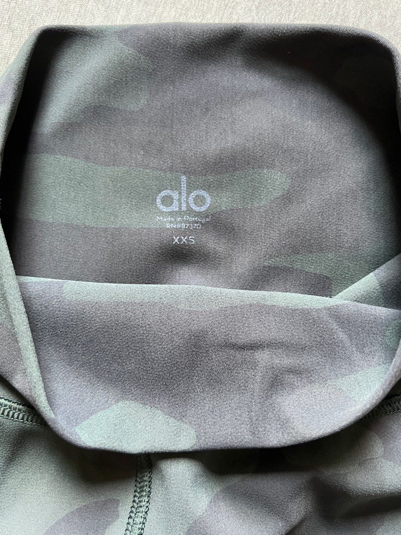 Alo Yoga Camo Leggings XXS (Category: Activewear) located in Singapore. Submitted by sweetiebuns (Listing ID 1375859233, Image 3). Description: Alo Yoga leggings - Dark camo print - High-waisted - Size: XXS - lighting used - Made in Portugal - Subtle sheen finish.