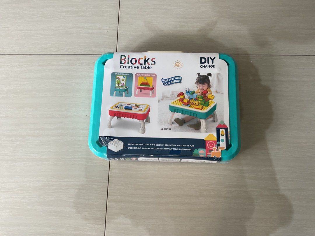 Blocks Creative Table (Category: Lego & Building Sets) located in Singapore. Submitted by magicgang (Listing ID 1375986607, Image 2). Description: It is a toy. The name is “blocks creative table”. It includes drawing board and building blocks. It is for kids age 3-7 years old. Length: 33cm, width: 8cm, height: 26cm.