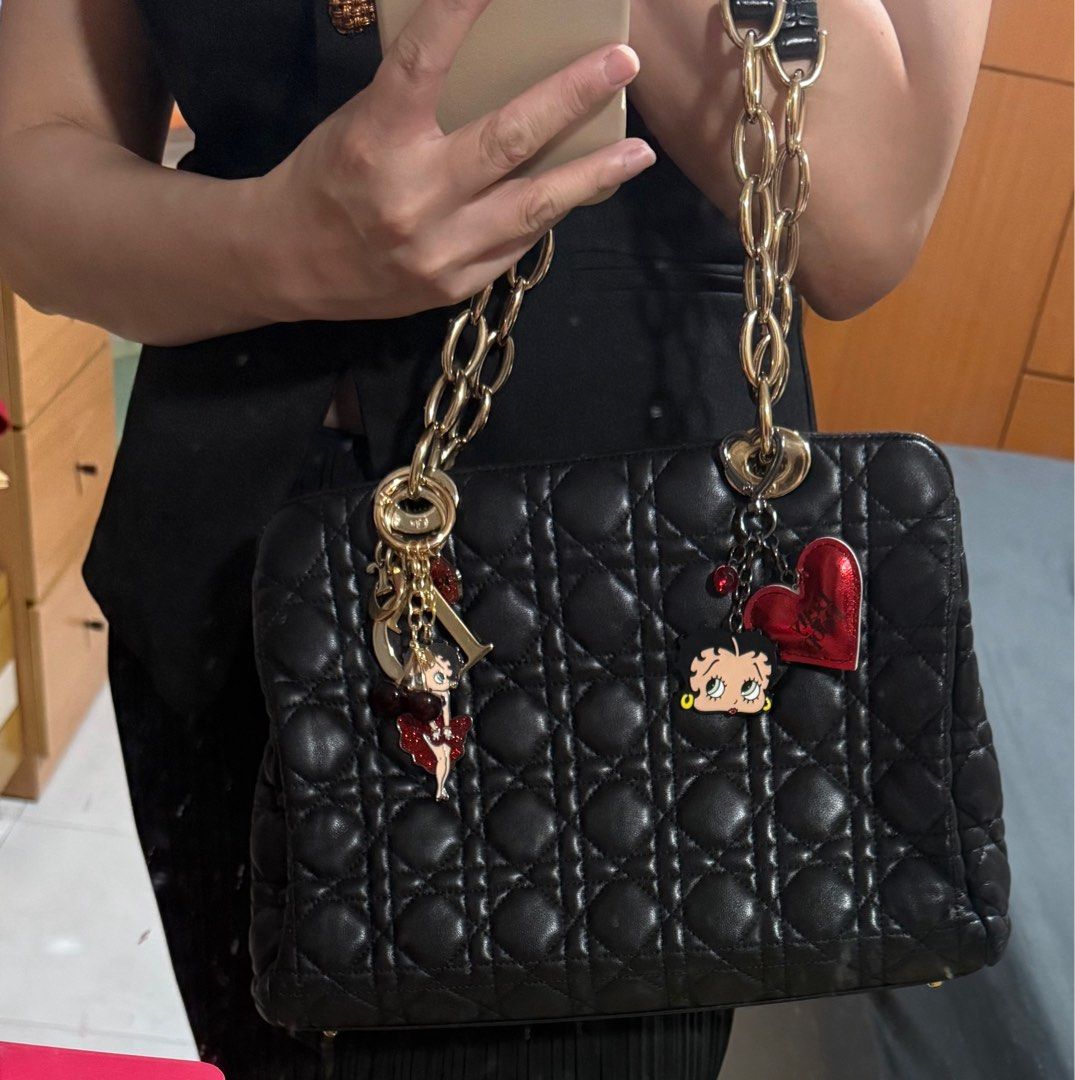 Dior Small Lambskin Cannage Soft Zipped Shopping Tote Bag (Category: Bags & Wallets) located in Singapore. Submitted by sweetpotato99909 (Listing ID 1371964350, Image 1). Description: Classic black quilted leather bag with gold chain detailing. The bag has a double zipper closure and a charm with the Dior logo. Perfect for everyday use or a special occasion. Length 31 cm Width 12 cm Height 23 cm Handle Drop 22.5 cm.