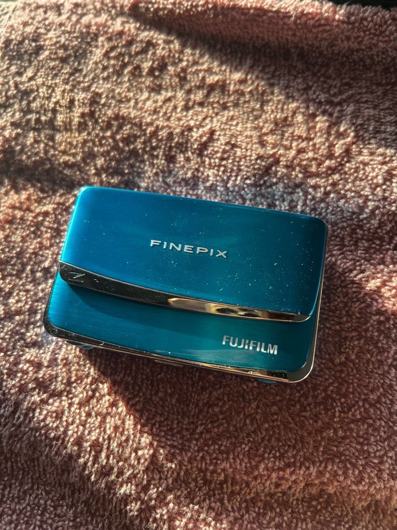 Fujifilm digicam Z70 - w/ box and strap (Category: Cameras) located in Binan City. Submitted by rl.ldl (Listing ID 1375841083, Image 2). Description: 📸 FUJIFILM Z70 / complete w/ box, charger, and strap 📸 RFS: Barely used, underutilized Resolution: 12 MP Sensor: 1/2.3 CCD Focal Length: 36-180mm Screen size: 2.7” Storage: SD/SDHC Weight: 124 g issues: screen sprites DM for mor details.