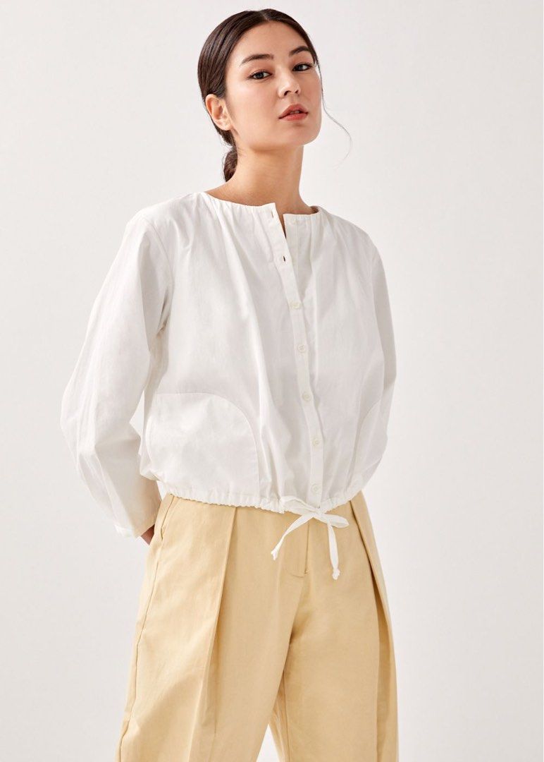 LB Austen Drawstring Outer (Category: Blouses) located in Singapore. Submitted by amb0n_ (Listing ID 1375979351, Image 2). Description: size M, see measurements in pic from the andrea chong collab some time back. thought I’d get more wear out of this but nope. really nice piece though, can be worn as a blouse or as an outer jacket! price includes normal mail tags: lb love bonito austen drawstring outer blouse top button andrea chong &rea white.