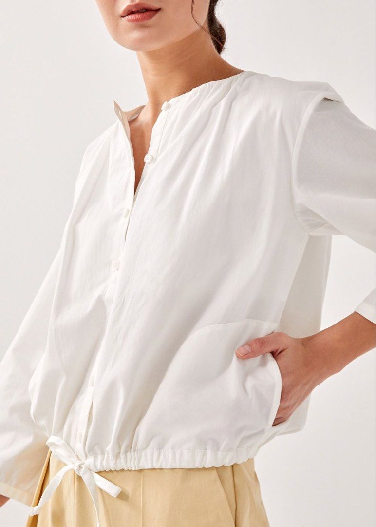 LB Austen Drawstring Outer (Category: Blouses) located in Singapore. Submitted by amb0n_ (Listing ID 1375979351, Image 3). Description: size M, see measurements in pic from the andrea chong collab some time back. thought I’d get more wear out of this but nope. really nice piece though, can be worn as a blouse or as an outer jacket! price includes normal mail tags: lb love bonito austen drawstring outer blouse top button andrea chong &rea white.