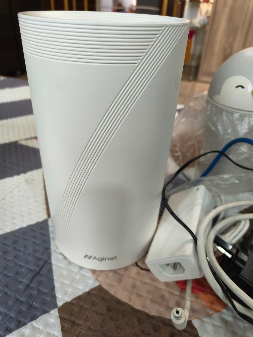 N-Agnet Router Wifi Modem (Category: Networking) located in Singapore. Submitted by florencegk85368 (Listing ID 1375892894, Image 1). Description: N-Agnet brand router. White cylindrical design with unique grooved texture. Includes power adapter and cable. Compact and aesthetically pleasing. Ideal for home or small office use. Easy setup and reliable performance..