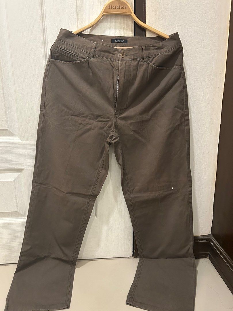 Orig DKNY Men's Trousers (Category: Trousers) located in Quezon City. Submitted by ecb0103 (Listing ID 1375859040, Image 1). Description: Original DKNY Men's pants/trousers Size 30 on tag Measurement when laid flat is waist to hem is 40 inches, waist to crotch is 12 inches Brown, khaki-ish Nice material.