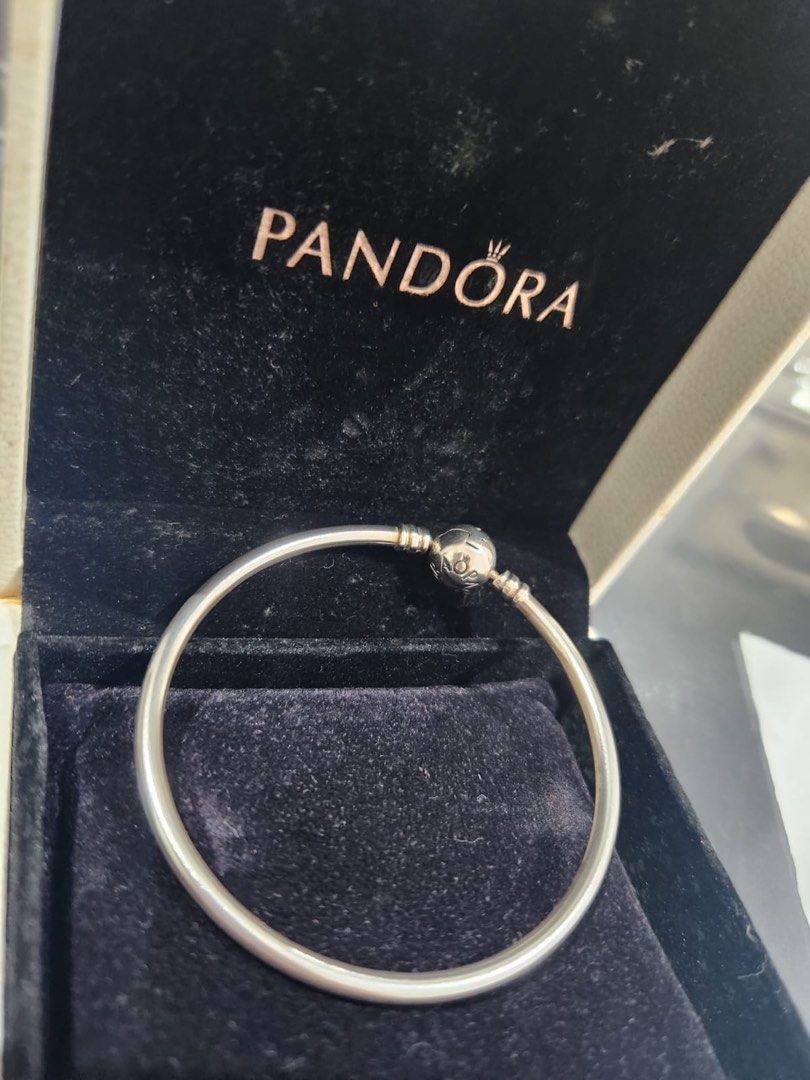 Pandora Bracelet (Category: Bracelets) located in Singapore. Submitted by tmm1976 (Listing ID 1375856468, Image 3). Description: Not worn before New Pandora new bangle n 2 new charms at sgd 150. Bangle diameter 5.5cm. Infinity charm x 1 and prosperity charm x 1. Comes in box n cleaning cloth..
