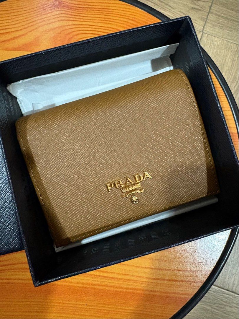 Prada Beige Saffiano Compact Wallet (Category: Luxury Bags & Wallets) located in Makati City. Submitted by buyerbuys123 (Listing ID 1376018068, Image 1). Description: Bought at Dubai outlet.