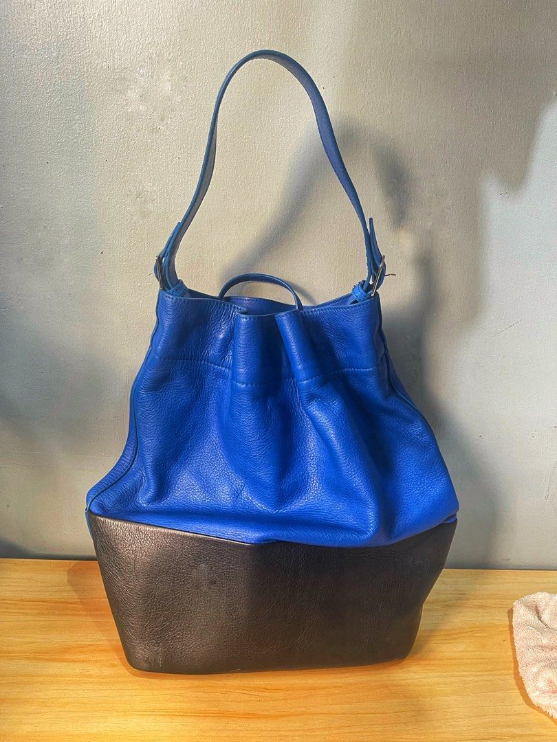 Seau Sangle leather tote Celine (Category: Luxury Bags & Wallets) located in Quezon City. Submitted by celebritycloset888 (Listing ID 1375935572, Image 2). Description: Celine Seau sangle tote / bucket bag, bi color. Bought in second hand store ni Bangkok. PM for more details.