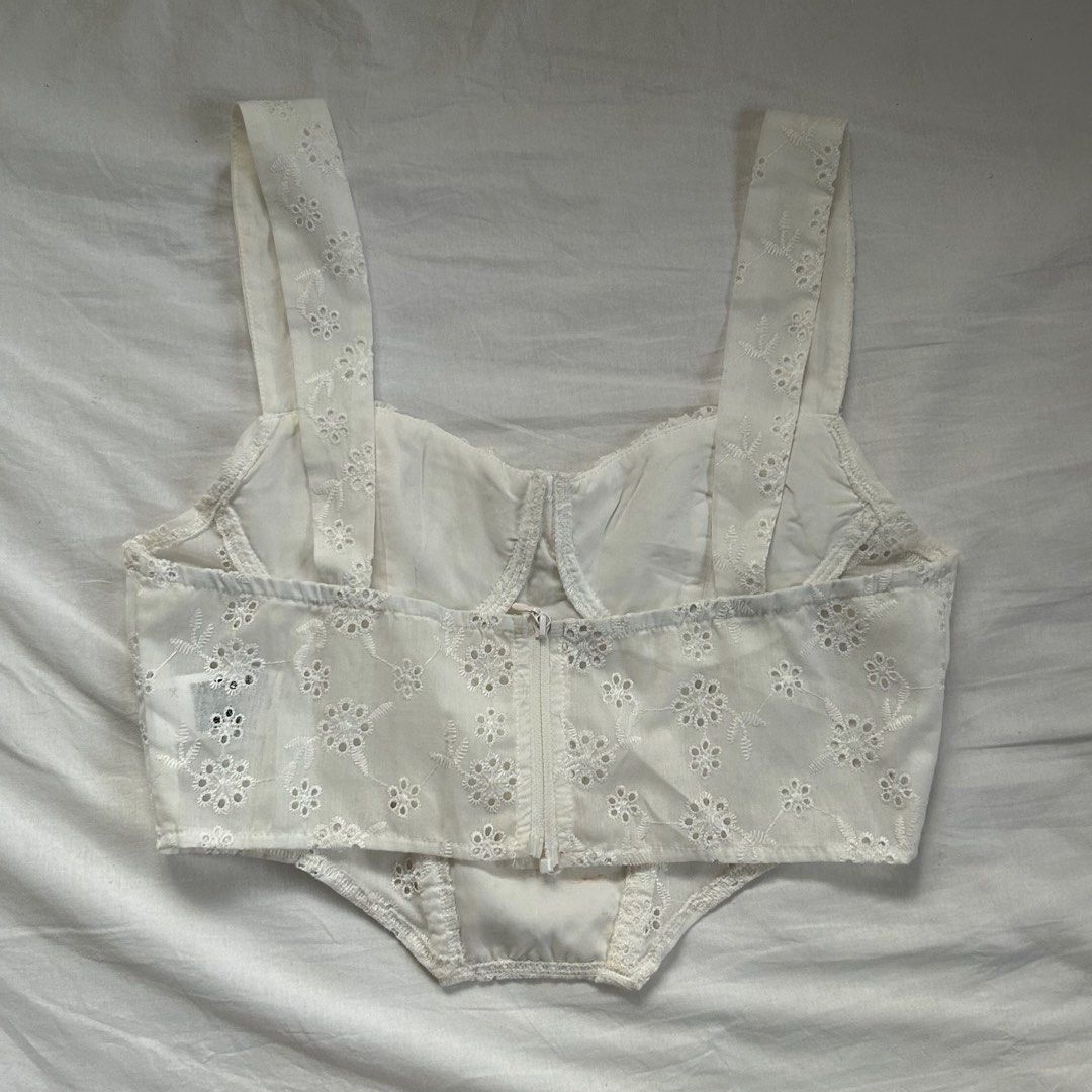Shein White Eyelet Cottagecore Sleeveless Top (Category: Sleeveless) located in Cavite. Submitted by kydeclutter (Listing ID 1375886716, Image 2). Description: - Worn twice - Such a cute summery and cottage core top - Small make up stains are visible but can be handwashed to remove it - Originally bought for ₱300+ - RFS: A bit loose on me on the chest area haha .