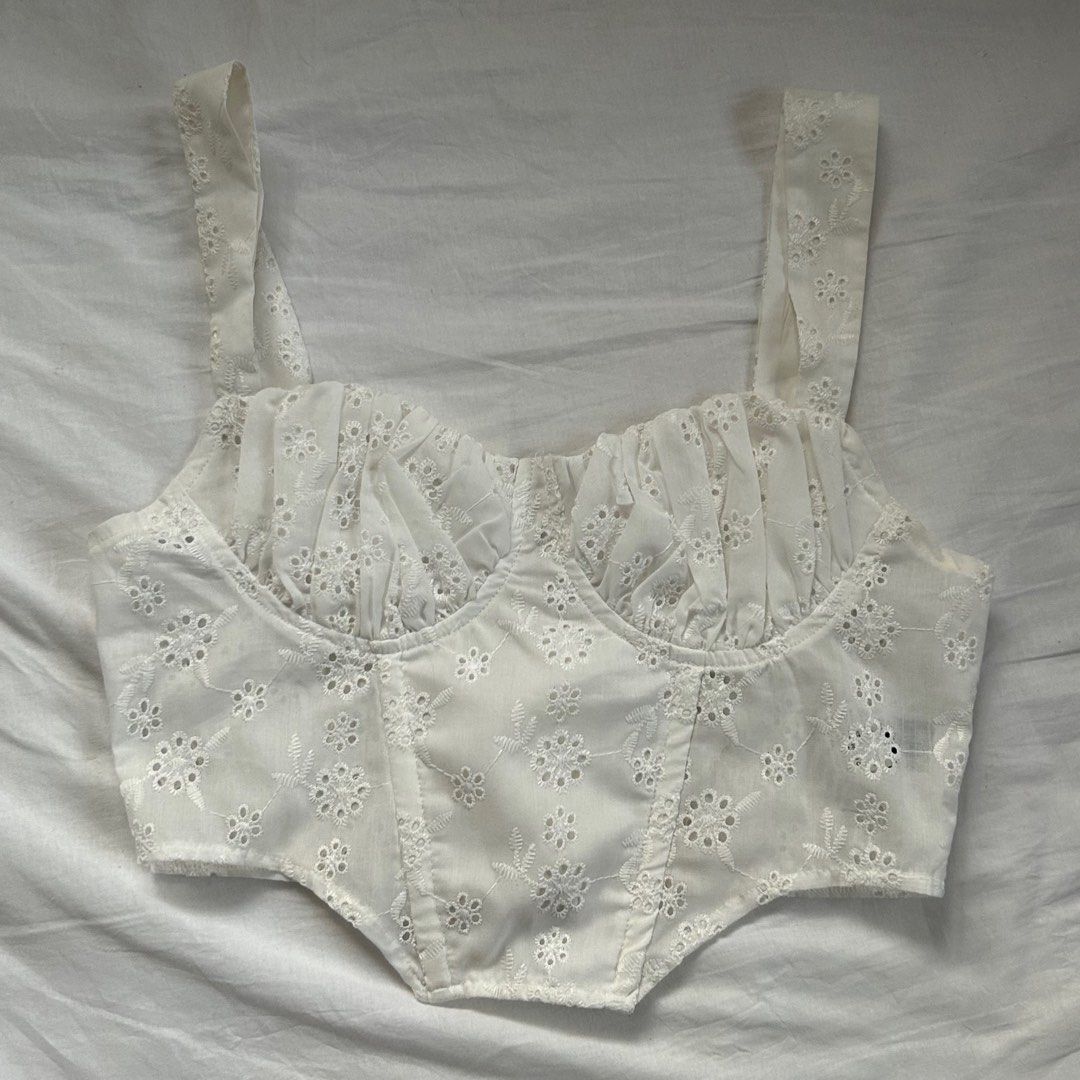Shein White Eyelet Cottagecore Sleeveless Top (Category: Sleeveless) located in Cavite. Submitted by kydeclutter (Listing ID 1375886716, Image 1). Description: - Worn twice - Such a cute summery and cottage core top - Small make up stains are visible but can be handwashed to remove it - Originally bought for ₱300+ - RFS: A bit loose on me on the chest area haha .
