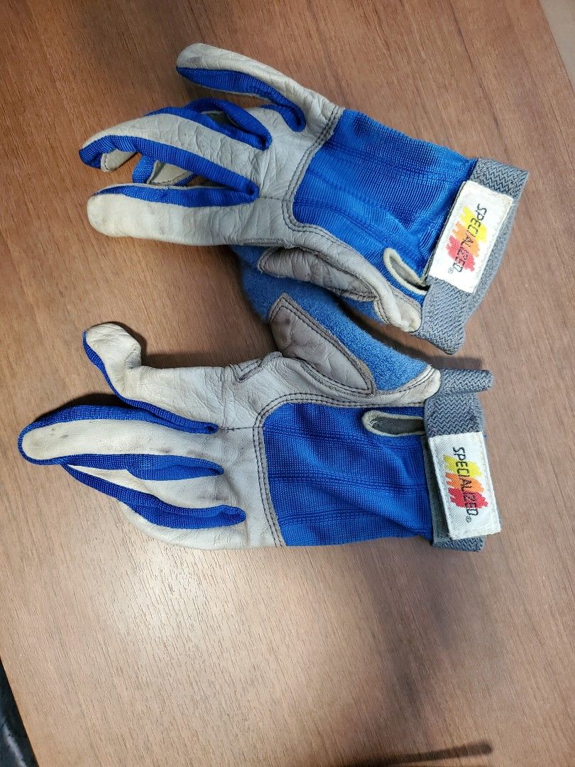 Specialized Cycling Gloves (Category: Parts & Accessories) located in Singapore. Submitted by easterntigerboo (Listing ID 1375889530, Image 1). Description: Blue and grey cycling gloves. Leather and mesh construction. Velcro wrist closure. Good for cycling and sports. Some wear..