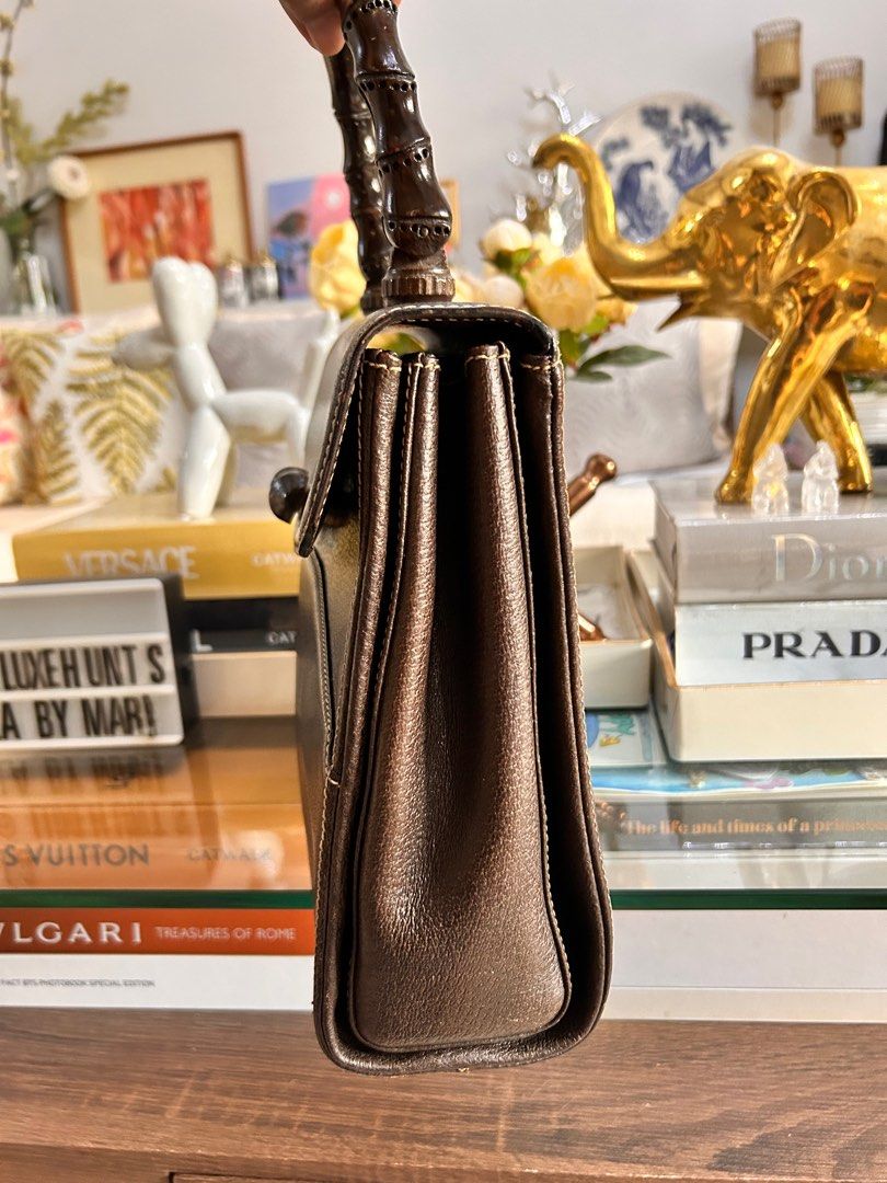💯 % Authentic Vintage Gucci Bamboo Top Handle Bag (Category: Luxury Bags & Wallets) located in Paranaque City. Submitted by luxehuntsmla.bymari (Listing ID 1376171827, Image 3). Description: 💯 % Authentic Vintage Gucci Bamboo Top-handle Bag 🔸In excellent condition 8.8/10 🔸 Clean inside and out 🔸Super nice in actual 💕 🔸leather interior lining 🔸 NO corner scuffs, tears, or foul smell. 🔸 Bag only Php 8500only 🔘🔘🔘 All items posted are gua