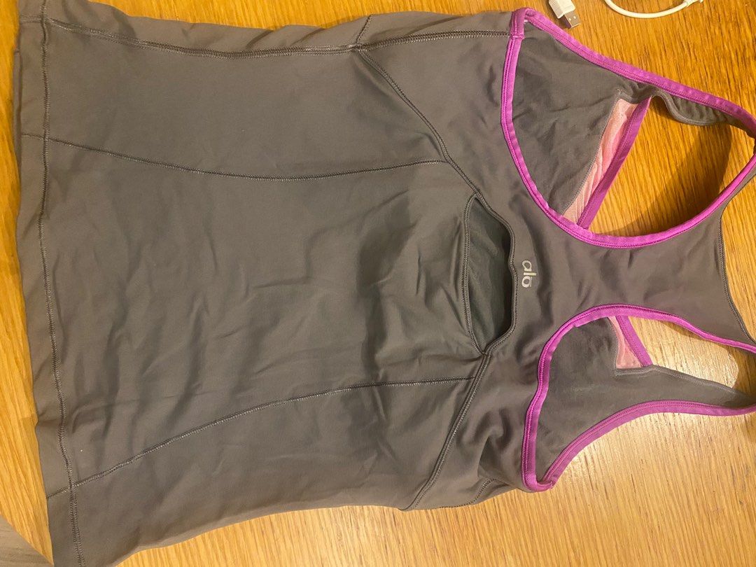 ALO yoga / sport top with built in bra (Category: Activewear) located in Taguig. Submitted by allthingspinkandpurple (Listing ID 1376162801, Image 2). Description: ALO yoga top. Slightly used but with the following issues : 1) the magenta color faded into the net/clear part of the top (from washing machine wash), and 2) I threw out the bra pads. The built in bra is very good - holds really well, and fully covers. .