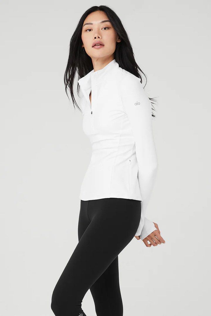Alo Yoga AloSoft 1/2 Zip Rapid Pullover in White (Category: Activewear) located in Singapore. Submitted by hellochrissyhello (Listing ID 1376056112, Image 2). Description: BNWOT, Great material & non see-through! Selling at a major loss bcus it’s the wrong size for me.. a pity🥲 Free postage for fast deals! 🤍.