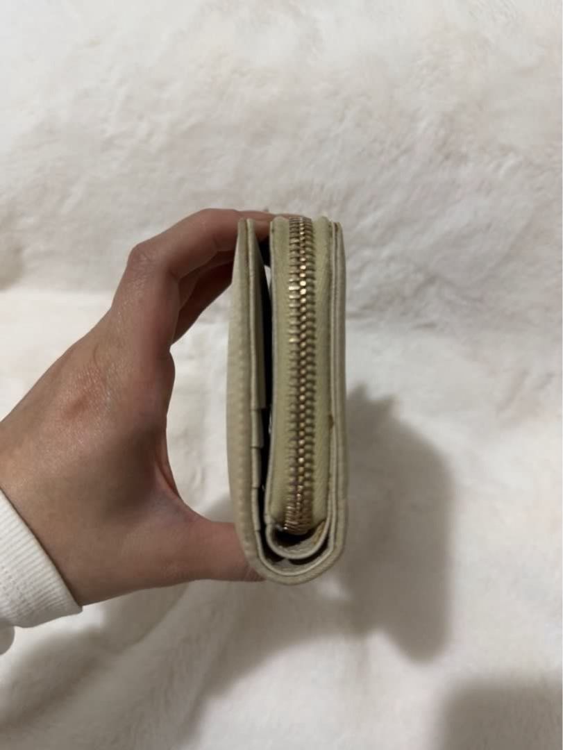 Authentic Prada Leather Nylon Compact Small Wallet Beige (Category: Luxury Bags & Wallets) located in Paranaque City. Submitted by authentic_mj (Listing ID 1376146333, Image 3). Description: Authentic Prada Leather Nylon Compact Small Wallet Beige Preloved Authentic from Japan Ideal for tap card during commute Recent bag spa to BagRx Rockwell Makati No inclusions Issue: Sign of usage Flaws: wrinkles and needs recolor.