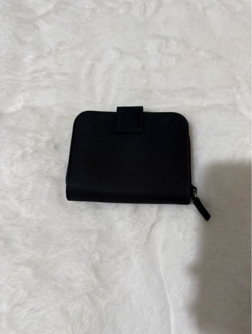 Authentic Prada Nylon Medium Compact Wallet (Category: Luxury Bags & Wallets) located in Paranaque City. Submitted by authentic_mj (Listing ID 1376157619, Image 2). Description: Authentic Prada Nylon Medium Compact Wallet Bought in Japan 10 card slots 2 bill slots 1 zip around coin purse (will fit more cards) No inclusions No visible flaws.
