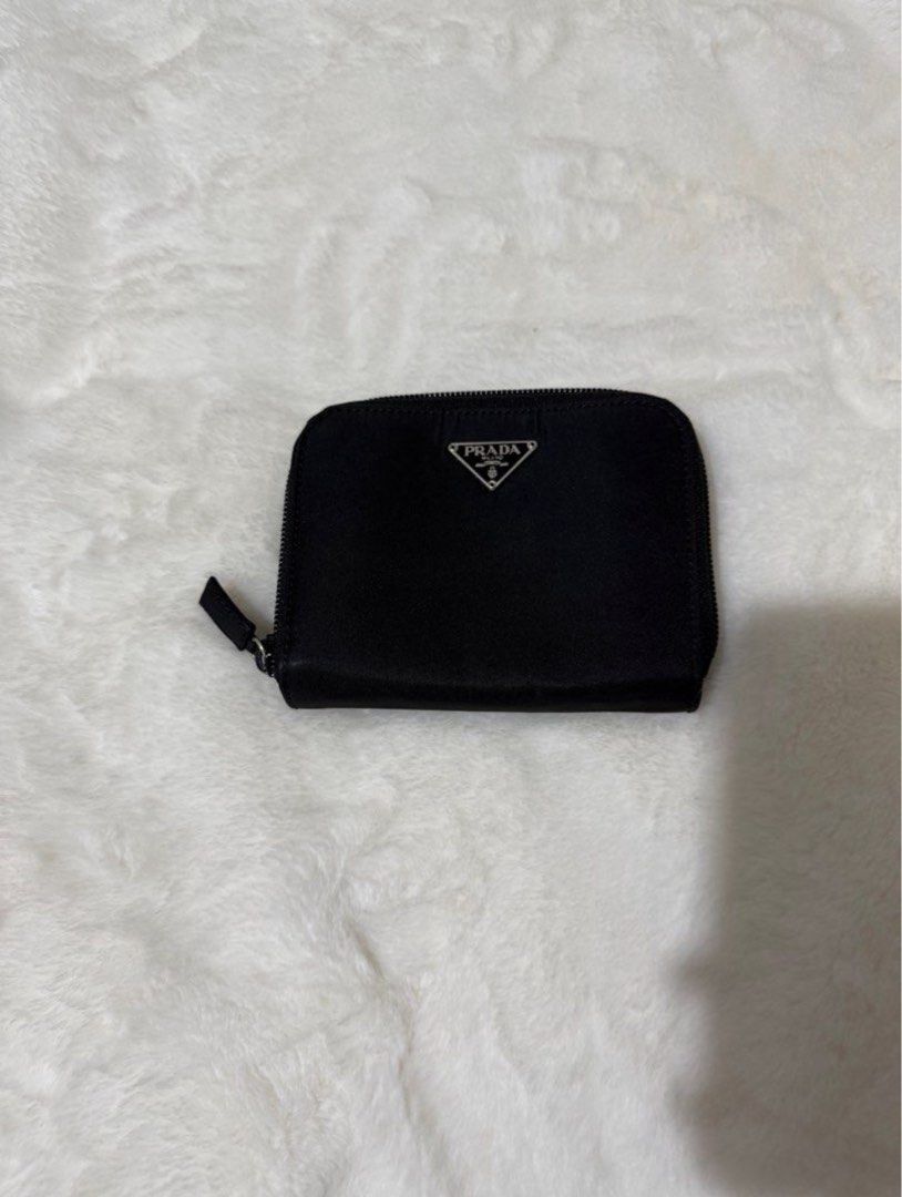 Authentic Prada Nylon Medium Compact Wallet (Category: Luxury Bags & Wallets) located in Paranaque City. Submitted by authentic_mj (Listing ID 1376157619, Image 1). Description: Authentic Prada Nylon Medium Compact Wallet Bought in Japan 10 card slots 2 bill slots 1 zip around coin purse (will fit more cards) No inclusions No visible flaws.
