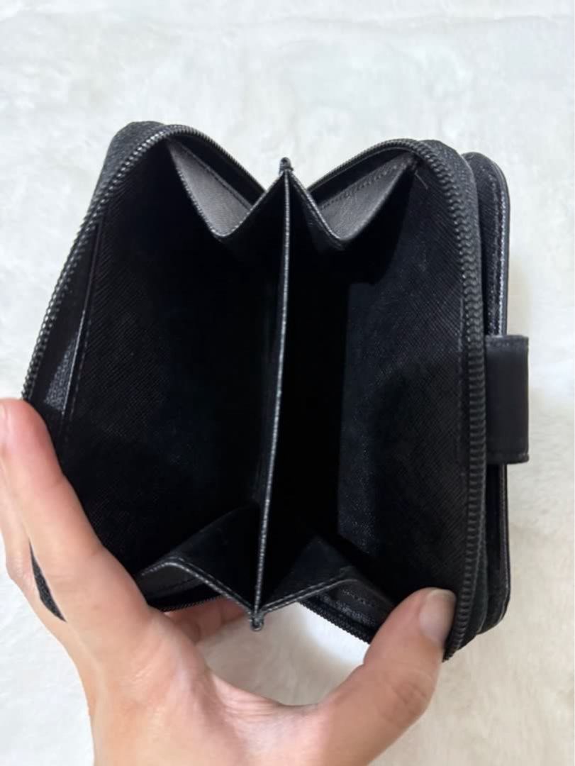 Authentic Prada Nylon Medium Compact Wallet (Category: Luxury Bags & Wallets) located in Paranaque City. Submitted by authentic_mj (Listing ID 1376157619, Image 3). Description: Authentic Prada Nylon Medium Compact Wallet Bought in Japan 10 card slots 2 bill slots 1 zip around coin purse (will fit more cards) No inclusions No visible flaws.
