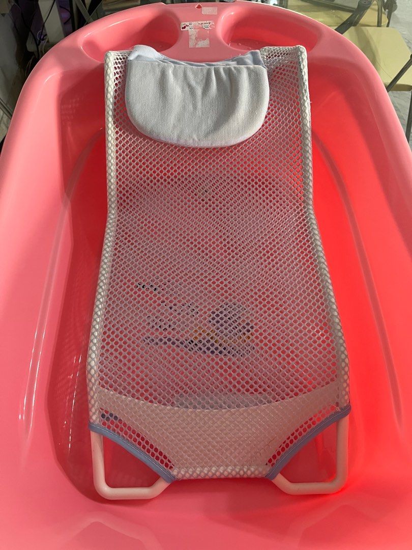 BabylOVE Pillow & Mesh Bath Bed (Category: Bathtub & Bath Accessories) located in Singapore. Submitted by imgniq (Listing ID 1376023596, Image 3). Description: - BabyLOVE Pillow & Mesh Bath Bed for newborns and infants. (Used once for 5 mins!) - Supportive mesh design. - Soft headrest pillow. - Lightweight and easy to clean. - Suitable for most standard bathtubs. - Provides comfortable and secure support during bath time. If you need a baby bounc