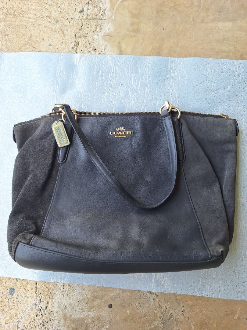 COACH Kelsey Satchel Bag (Category: Luxury Bags & Wallets) located in Malaybalay. Submitted by mags_sofia (Listing ID 1376063925, Image 1). Description: Dimensions: L: 15.5", W: 4", H: 11" Material: - leather and cowhide exterior - clothed interior - leather handles - gold brass hardware Compartments: - main compartment and 1 zipped pocket and two slots Signs of Wear: - leather handles are wearing off - exterior is slightly worn off - interior is