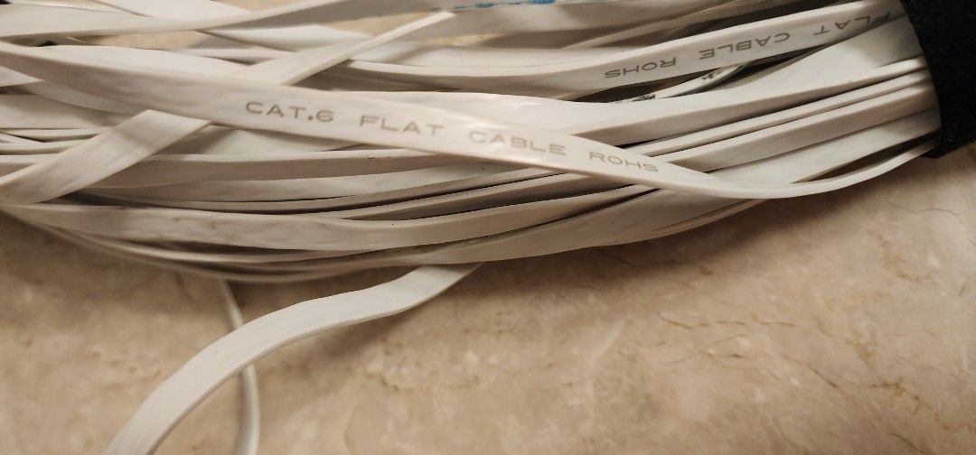 Lan Flat Cable Cat 6 (Category: Cables & Adaptors) located in Singapore. Submitted by decluttering2000 (Listing ID 1376151044, Image 2). Description: Lightly used. Has some bluetak on it but otherwise still clean. About 30m long. Please check item upon receipt, no refunds nor returns after purchase..