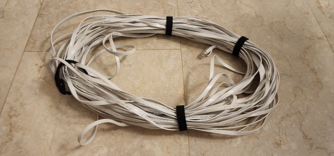 Lan Flat Cable Cat 6 (Category: Cables & Adaptors) located in Singapore. Submitted by decluttering2000 (Listing ID 1376151044, Image 1). Description: Lightly used. Has some bluetak on it but otherwise still clean. About 30m long. Please check item upon receipt, no refunds nor returns after purchase..