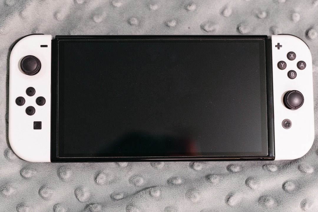 Nintendo Switch Oled White (Category: Nintendo) located in Quezon City. Submitted by cms1116 (Listing ID 1376111641, Image 1). Description: -with Hello Kitty Adventure game -female owner - ilan beses lang nagamit. nakatago lang sa bahay. -with box .