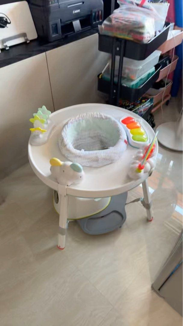 Skip Hop Explore & More Jumpscape Foldaway Jumper (Category: Infant Playtime) located in Singapore. Submitted by j.torres (Listing ID 1376068359, Image 1). Description: This Skip Hop Explore & More Jumpscape Foldaway Jumper is a great way to keep your little one entertained and engaged. It features a 360-degree rotating seat, allowing your baby to explore all the fun activities around them. The jumper has a variety of toys, including a light-up p