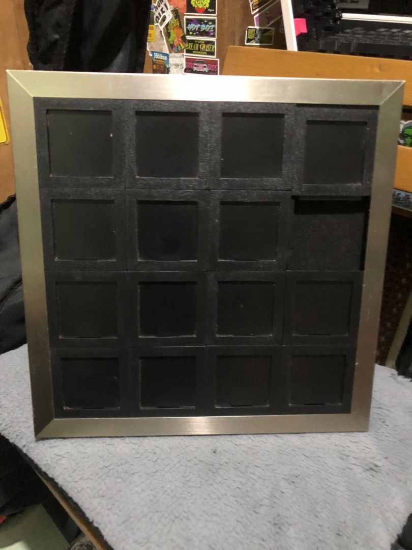 Sliding puzzle picture frame (Category: Frames & Pictures) located in Quezon City. Submitted by markgolveo (Listing ID 1376197857, Image 1). Description: Sliding puzzle picture frame 32x32cm 7cm per square tiles.