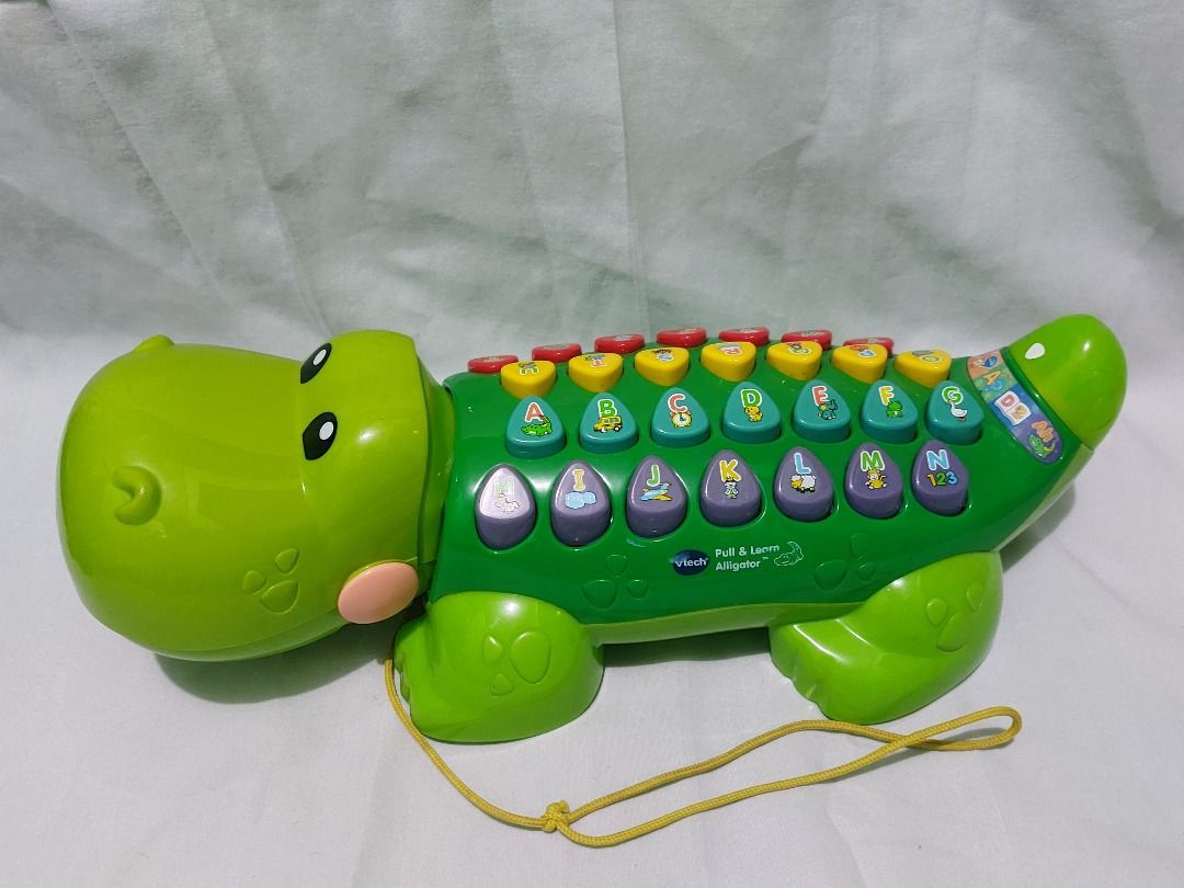Vtech Pull & Learn Alligator (Category: Educational & Learning Toys) located in Paranaque City. Submitted by ca.firstonlinebiz (Listing ID 1336737523, Image 1). Description: Preloved Vtech Pull & Learn Alligator Lights and sounds working well English Language All buttons are working Battery not included needs 2xAA Loc. Greenheights Parañaque Open for shipping lalamove jnt or flash Gcash, Maya, BPI payment.