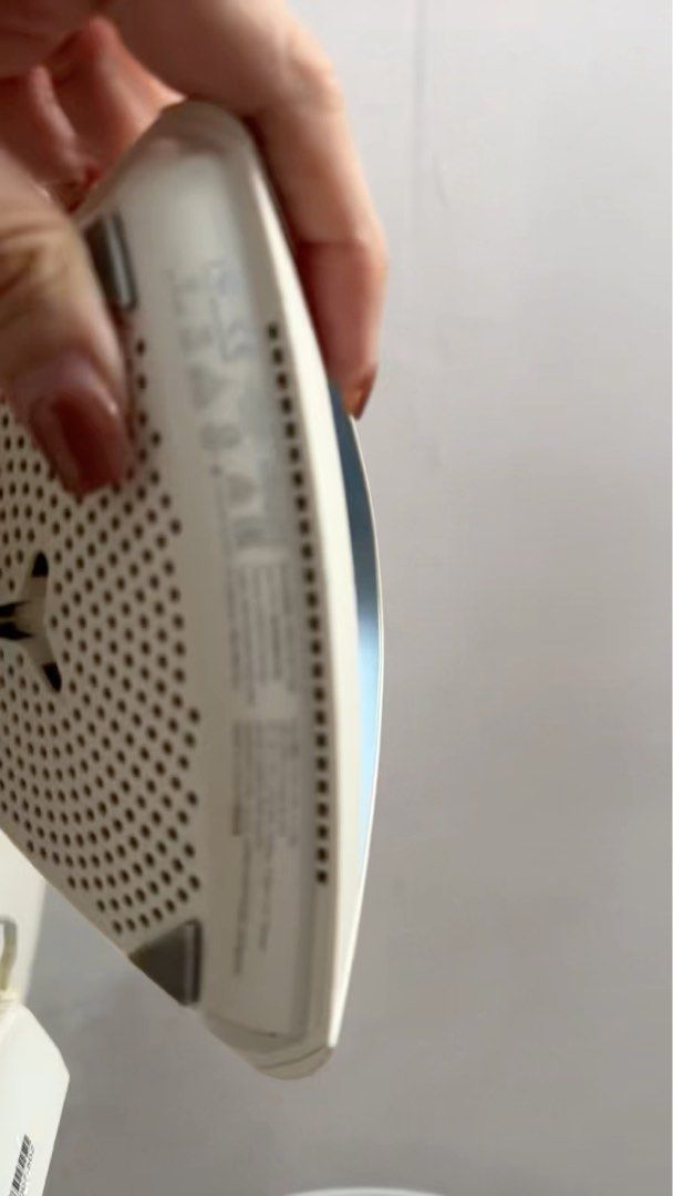 ASUS Router (Category: Networking) located in Singapore. Submitted by judatribe (Listing ID 1376302731, Image 3). Description: This is an ASUS router. It is white with a blue handle. The router is in good condition and comes with its power adapter. The router is designed to be mounted on a wall. The bottom of the router has a lot of holes for ventilation. The router is in good condition and ready to be used. It is a great addition to any home or 