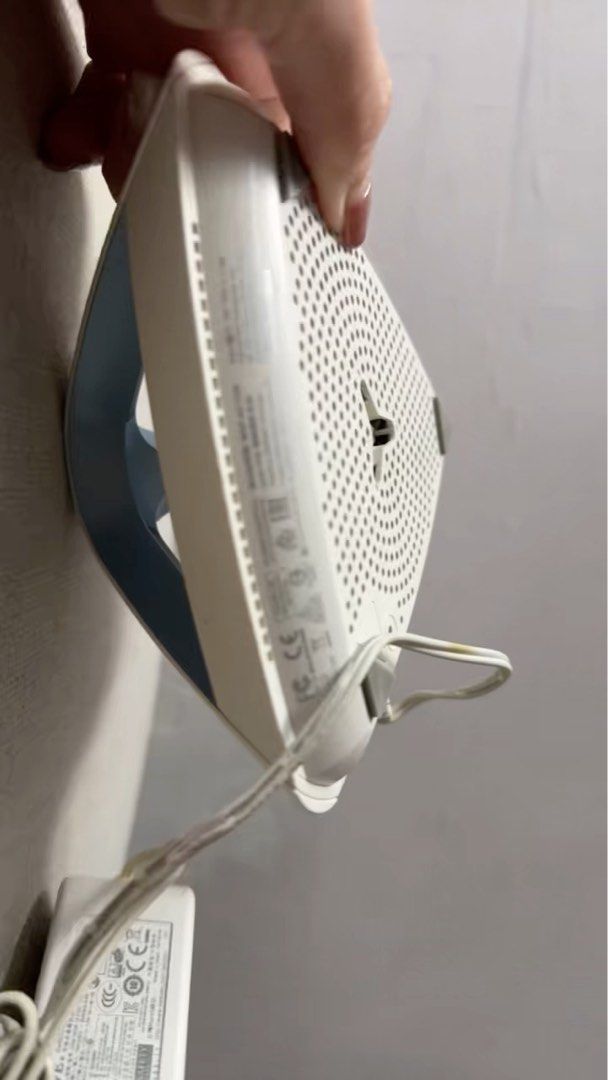 ASUS Router (Category: Networking) located in Singapore. Submitted by judatribe (Listing ID 1376302731, Image 1). Description: This is an ASUS router. It is white with a blue handle. The router is in good condition and comes with its power adapter. The router is designed to be mounted on a wall. The bottom of the router has a lot of holes for ventilation. The router is in good condition and ready to be used. It is a great addition to any home or 