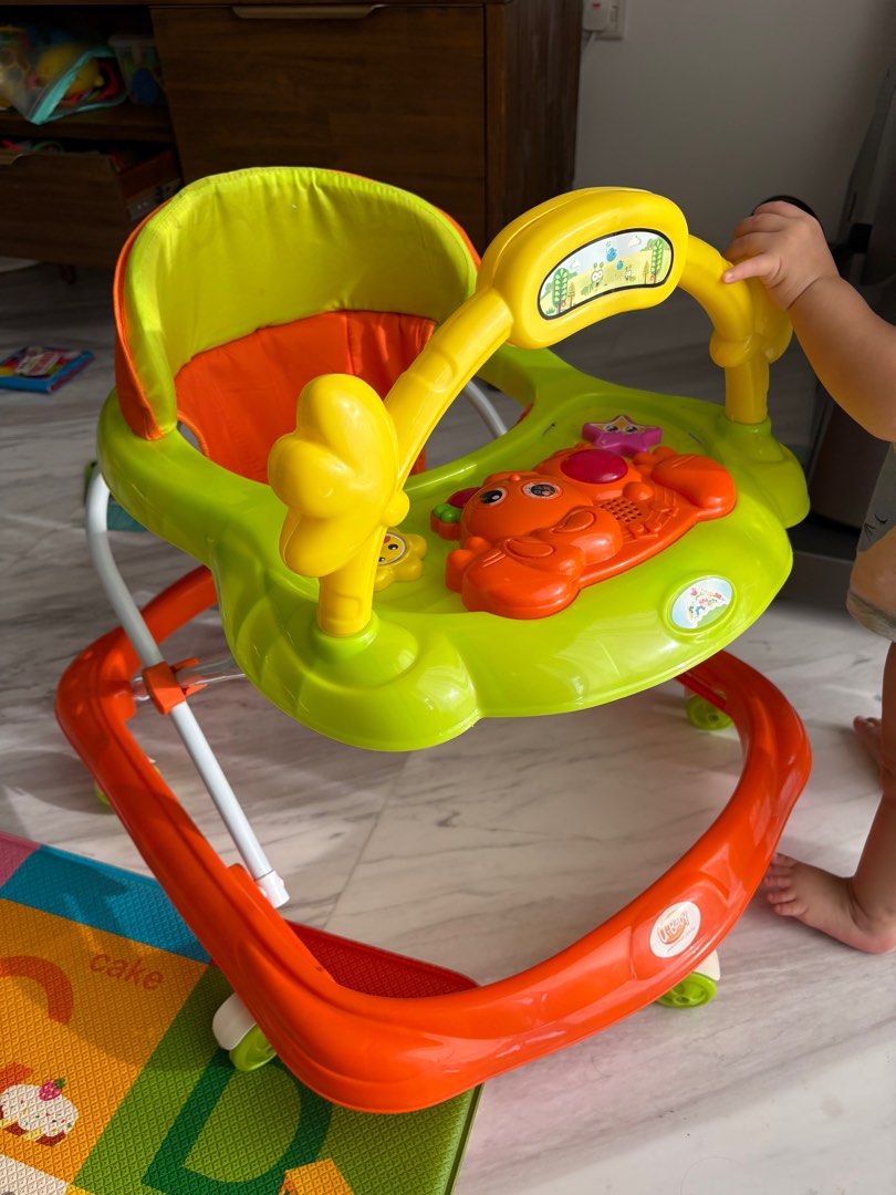 Baby walker with music (Category: Infant Playtime) located in Singapore. Submitted by Quekie (Listing ID 1376220736, Image 1). Description: Only bought and used for 6 months. Baby doesn’t need it anymore. Able to shrink it as portable item. .