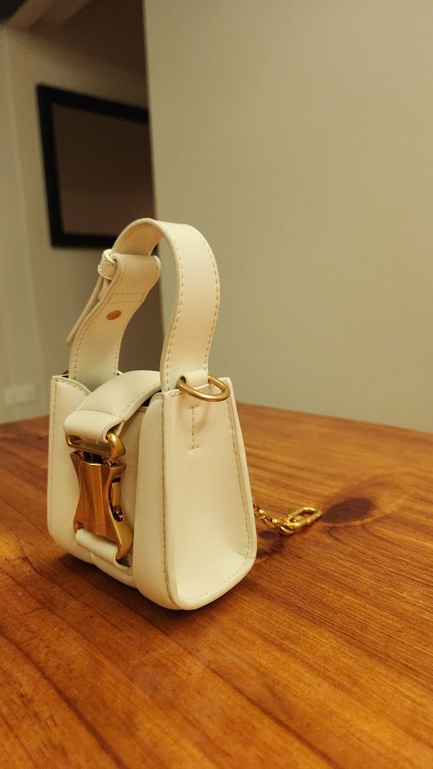 Charles & Keith Bag (Category: Purses & Pouches) located in Singapore. Submitted by kidswarrior (Listing ID 1376221775, Image 3). Description: • Ivy Top Handle Mini Bag - cream •Used once or twice • condition 8.5/10 • Meet up at Canberra mrt.
